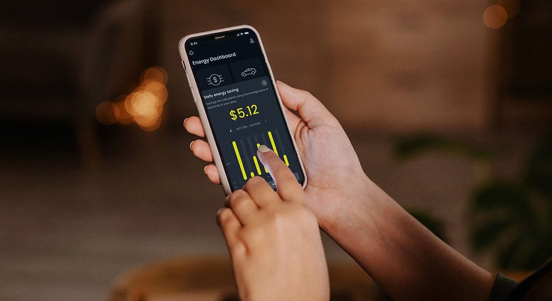Hand holding mobile phone showing the dcbel app
